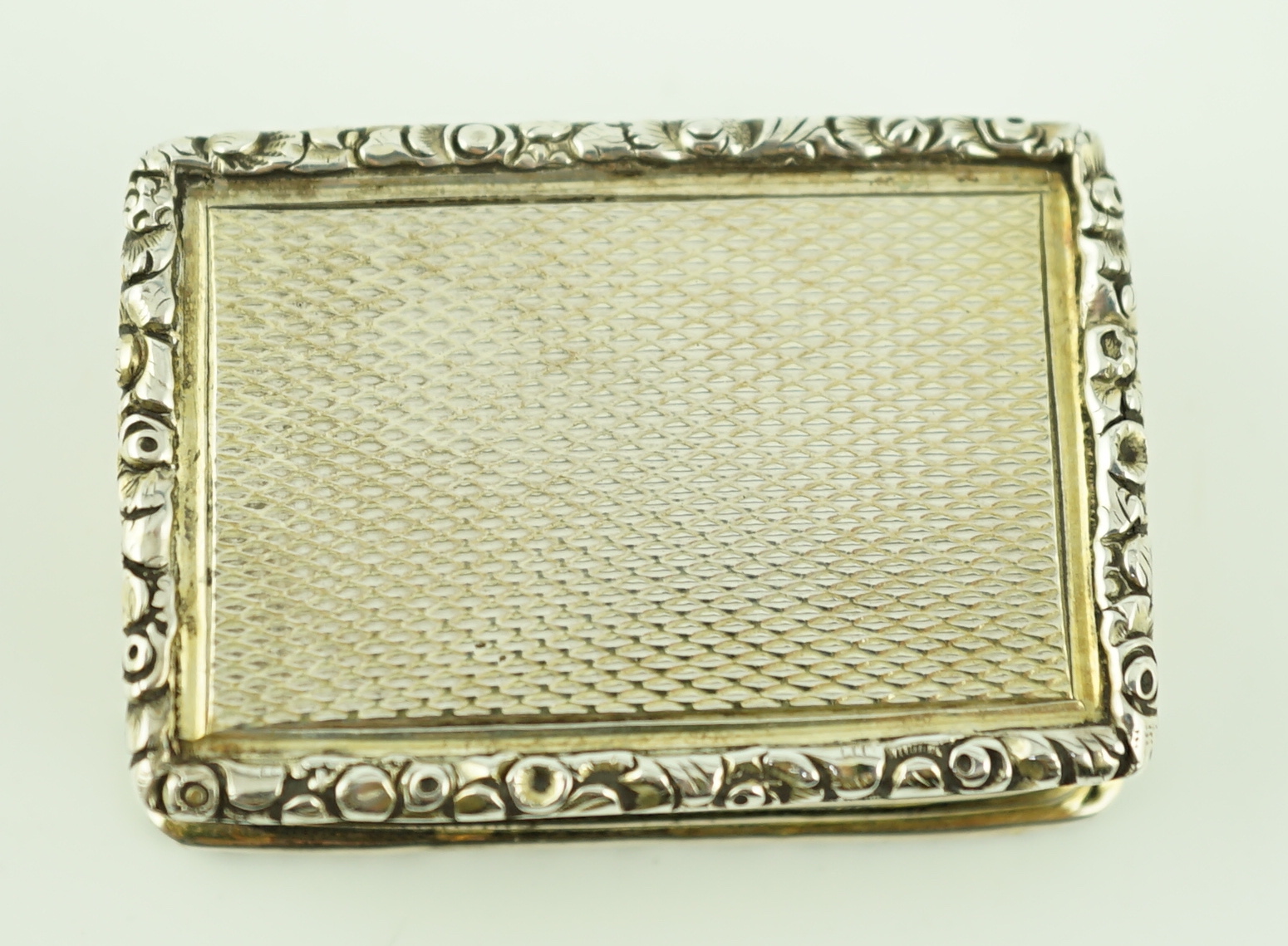 A William IV engine turned silver gilt rectangular vinaigrette, by Joseph Wilmore